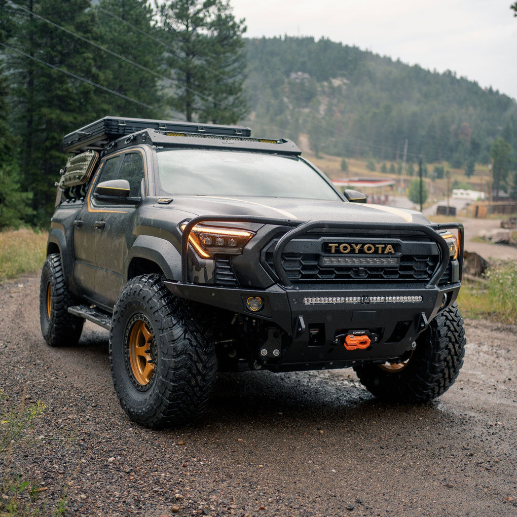 Elevated view of the front end of a 2024 Tacoma equipped with a flat-top Overland bumper from C4, illustrating how tight to the original lines the bumper sits. 