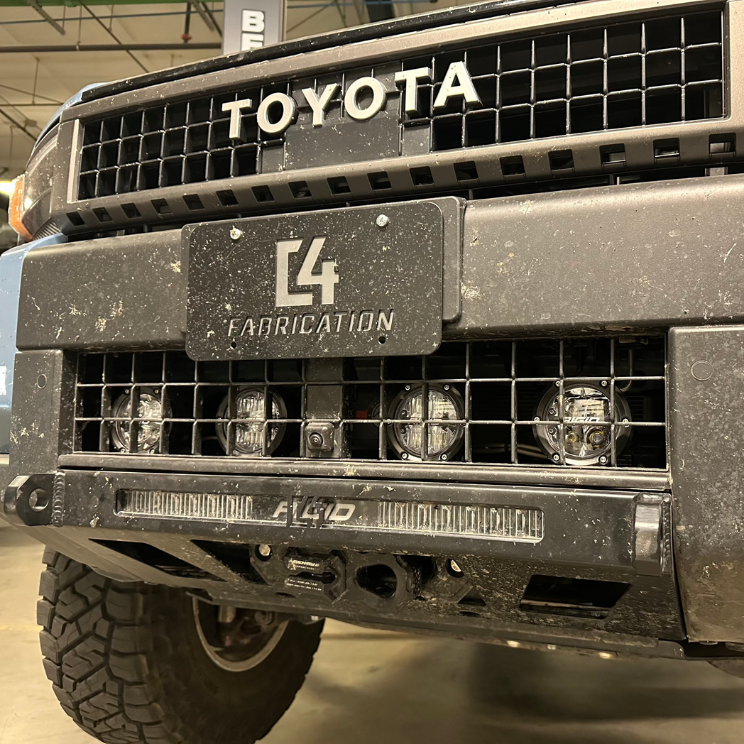 Close up of the C4 Lo-Pro winch bumper for the Land Cruiser LC250 with winch and Rigid light bar installed.
