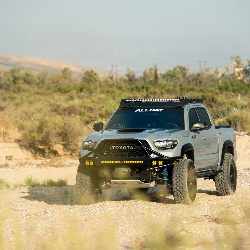 Blue Toyota Tacoma with C4 winch bumper.