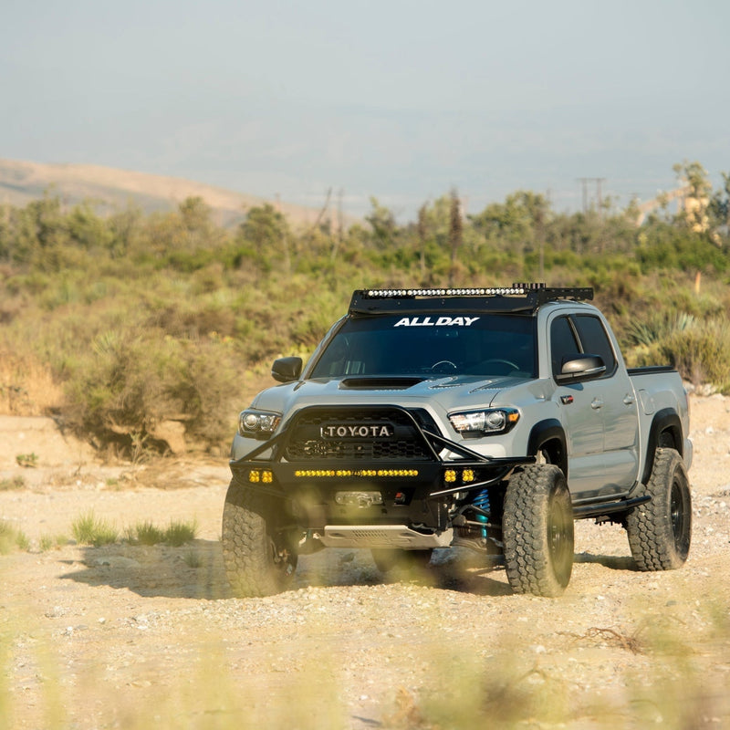 Blue Toyota Tacoma with C4 winch bumper.
