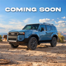 Graphic with a blue Land Cruiser 250 and the words 'Coming Soon' announcing the pending development and release of additional armor options for the LC250 from C4 Fabrication.