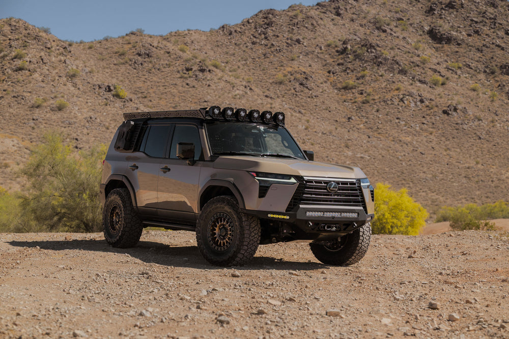 GX 550 off road equipped in a desert landscape with mountains in the background