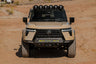 Front view of the GX 550 with off road bumpers, roof rack, and molle panels.