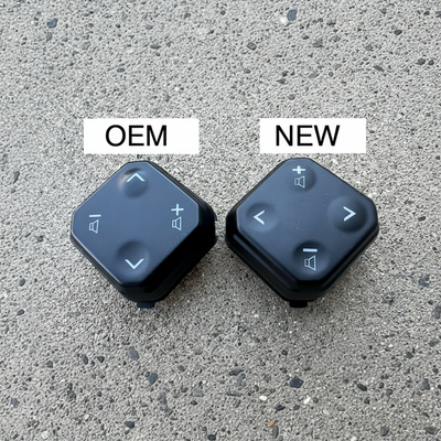 Two control buttons labeled 'OEM' and 'NEW' on a textured surface.