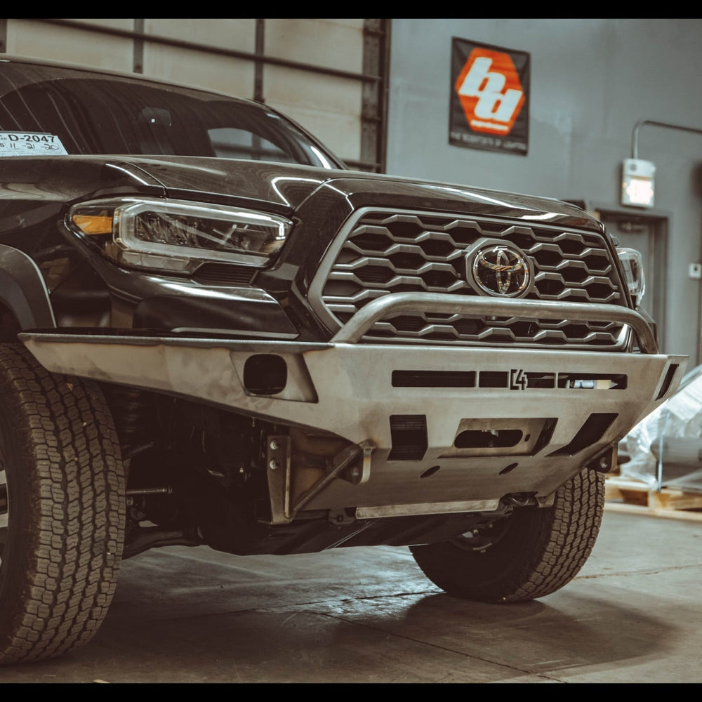 C4 Overland front winch bumper for the 3rd Gen Tacoma in raw steel.