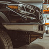 Close-up side view of the C4 Overland front bumper with mid-height bull bar showing how tight the bull bar fits to the grille.