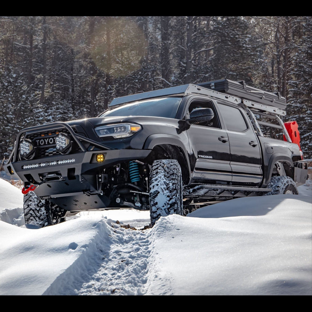 Tacoma in the snow and equipped for adventure.