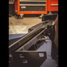 View of the inside of the rear Overland bumper showing the square tube hidden under the plate body that provides the base framework for the bumper.