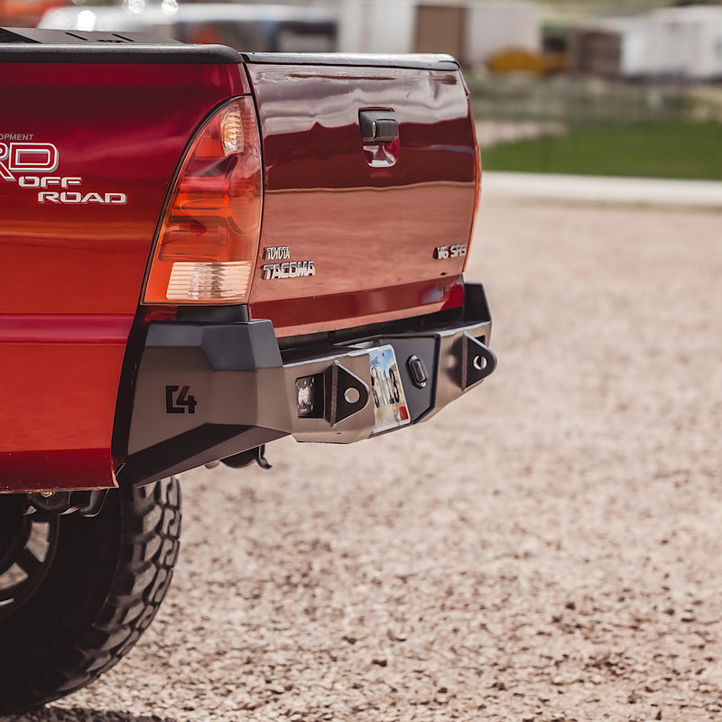 Side quartering view of the C4 Overland rear bumper showing the fabricated plate metal bumper endcaps and beefy tow points integrated into the bumper.