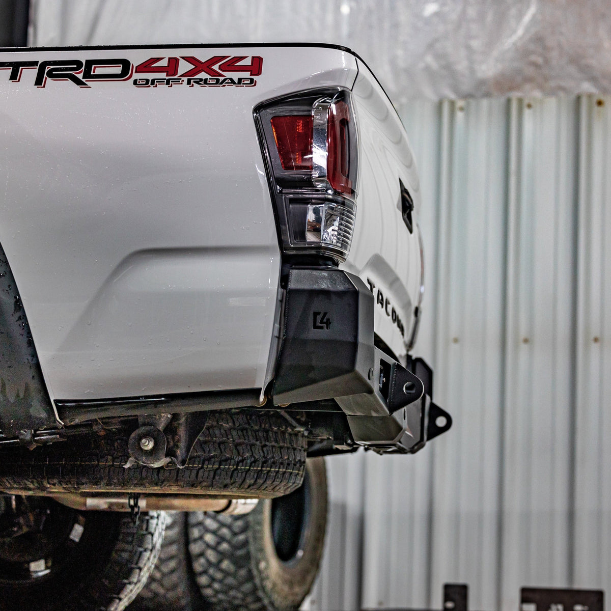Cover photo for the C4 Overland Rear Bumper for 3rd Generation Toyota Tacomas with the background faded out and emphasis on the vehicle and its bumper.