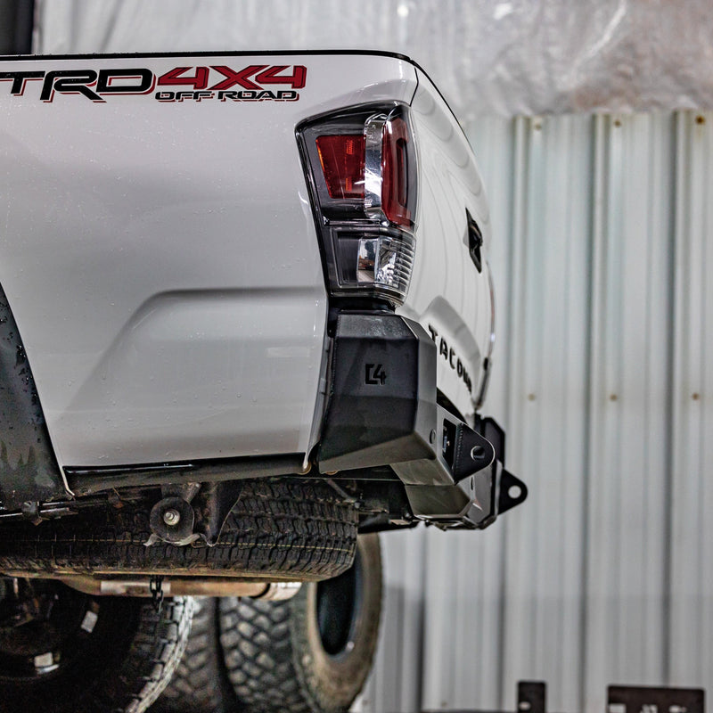 Low angle view showing the tow points and steel structure of the C4 Overland rear bumper for 3rd Gen Tacomas. 