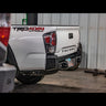 Black C4 Overland bumper installed on a white Tacoma.