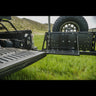 Wider view showing the fold-down table on the C4 swing-out bumper and how it corresponds to the height of the tailgate when folded down.