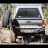 Tan Tacoma showing off the swing-out bumper system from C4 Fabrication.