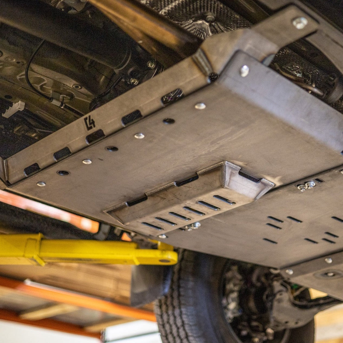 Cover photo showing the C4 Fabrication rear skid plate for the 2nd Generation Toyota Tacoma.