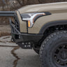 Close-up shot from the side of the C4 Overland bumper for the Toyota Tundra showing its tight conformation to the front of the grille.