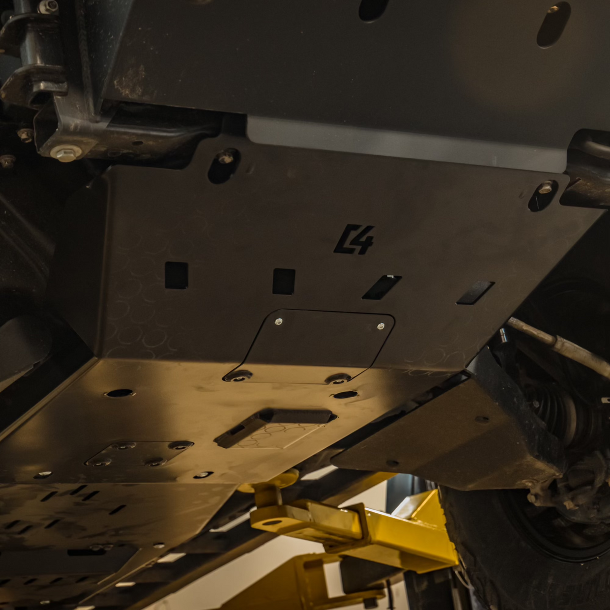 Cover photo for the C4 Full Skid Set for the 2nd Gen Tacoma with the background faded out and emphasis on the skid plates.