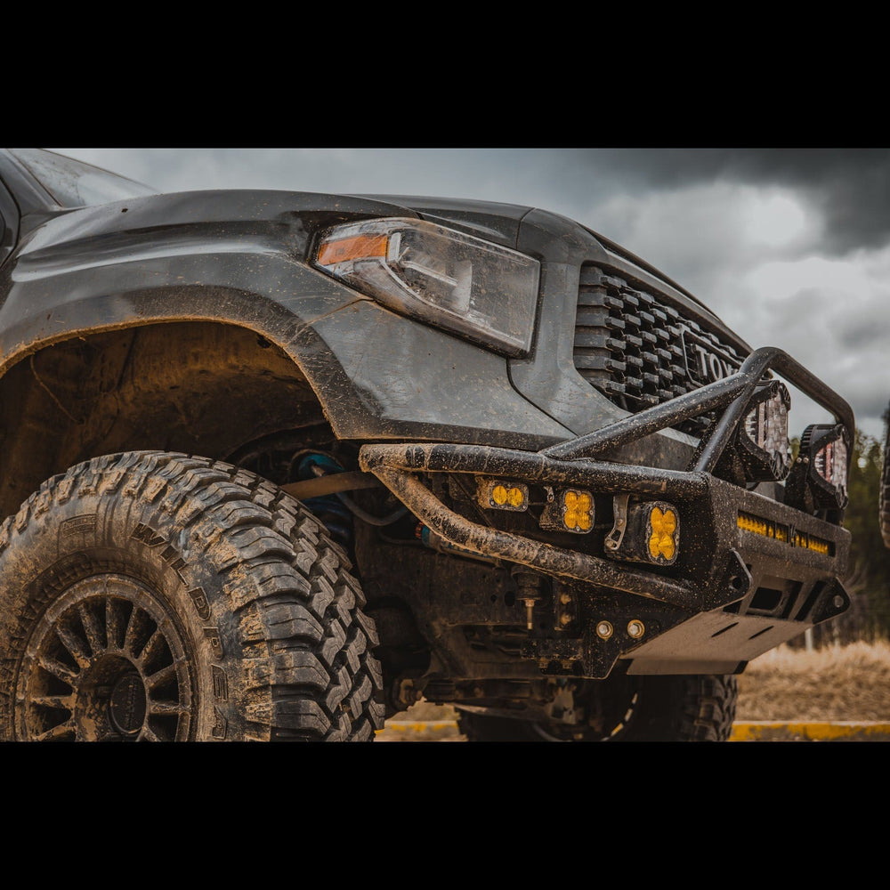 Quartering side angle showing the C4 Hybrid bumper for the 2014+ Toyota Tundra installed on a widebody-modified truck. 