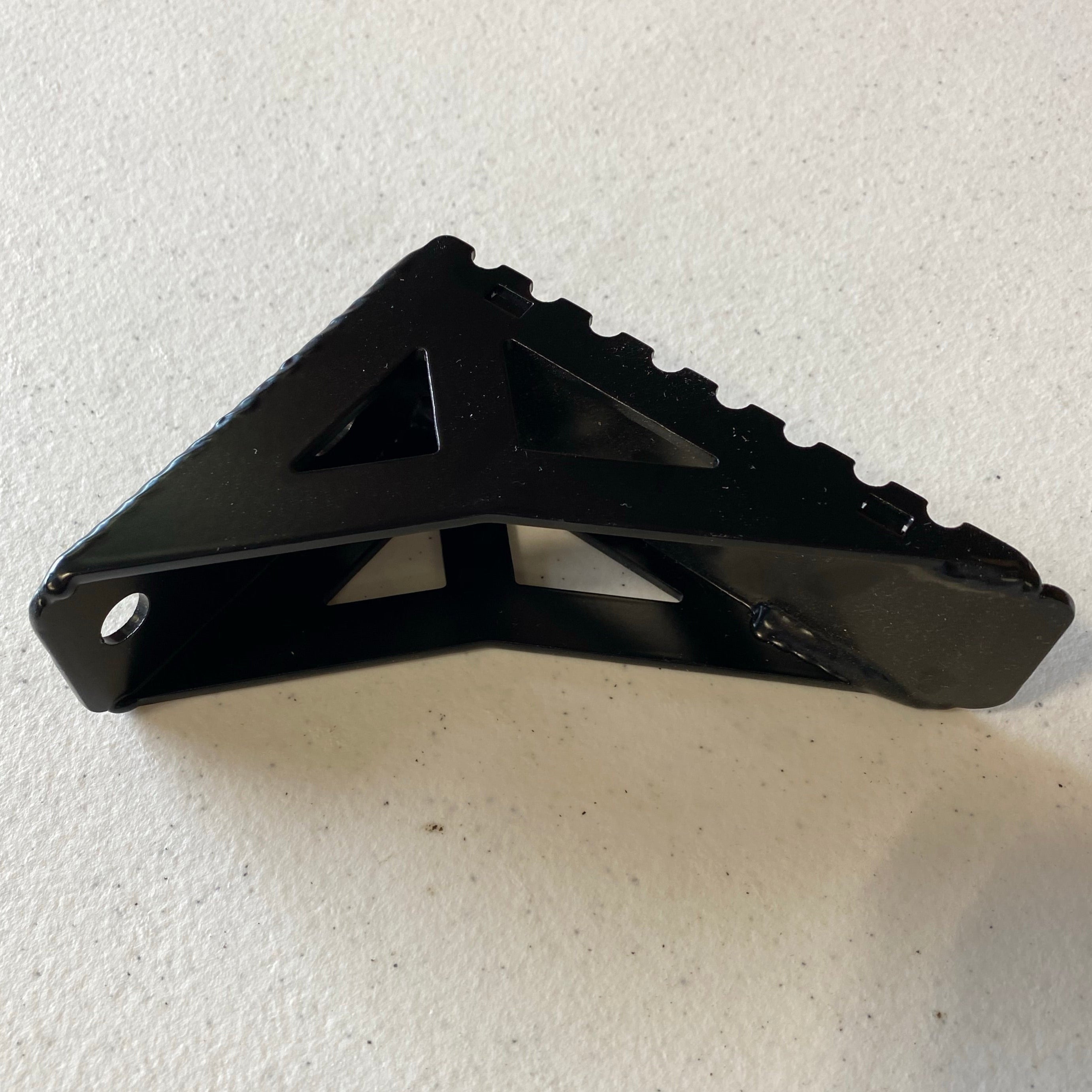 Close up image of the accessory side step for the C4 Summit hatch ladder showing its double-gusseted construction and serrated top step pad. 