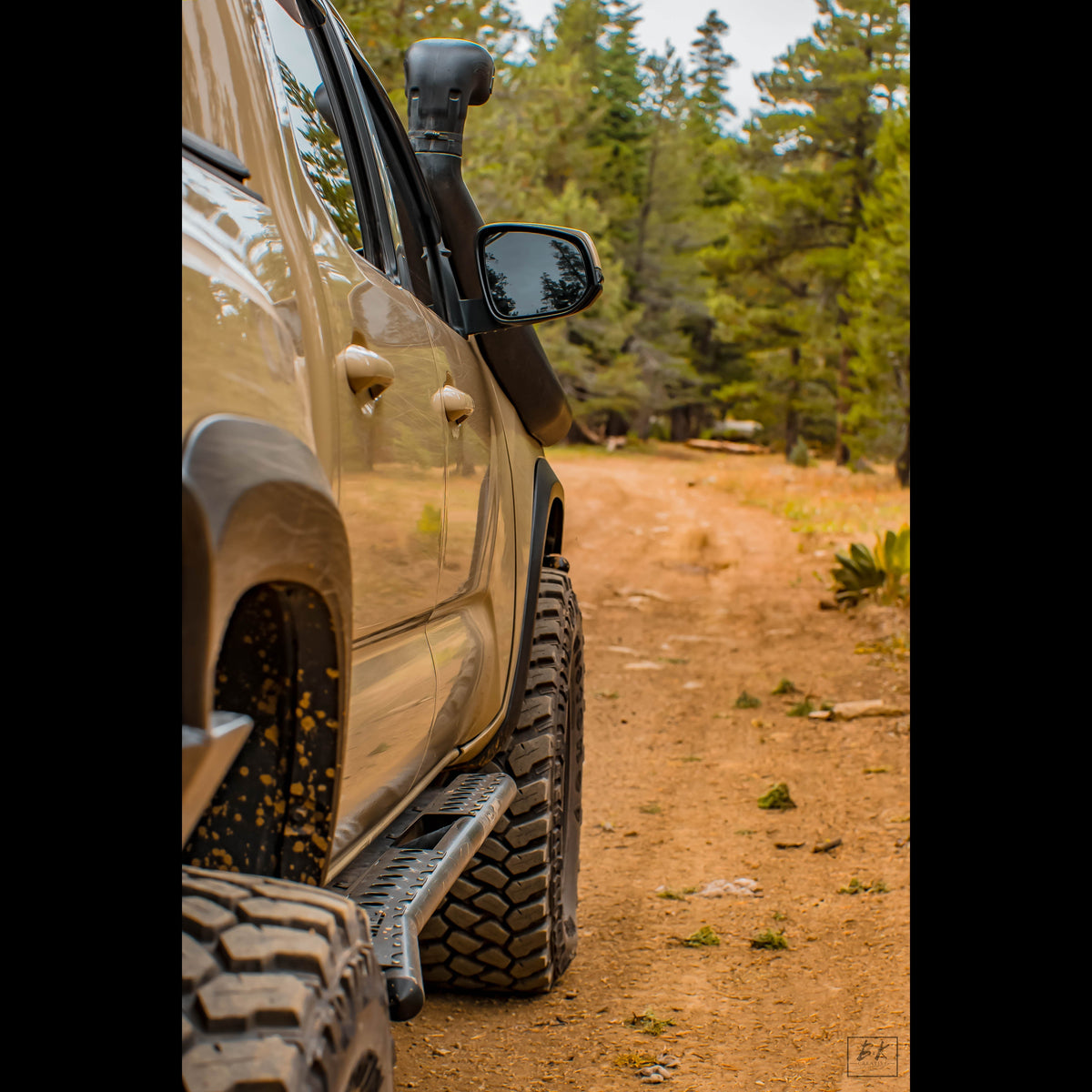 Cover photo for the C4 Fabrication rock sliders built for the 3rd Generation Tacoma with emphasis on the truck and sliders and the background faded away.