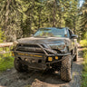 Quartering on photo of a muddy 5th Gen 4Runner equipped with a C4 Hybrid bumper.