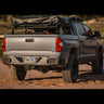 Modified Toyota Tundra with roof top tent installed on a bed rack and the C4 Overland rear bumper.