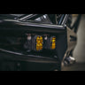 Close up of two Baja Designs lights mounted in the wings of a C4 Hybrid bumper.