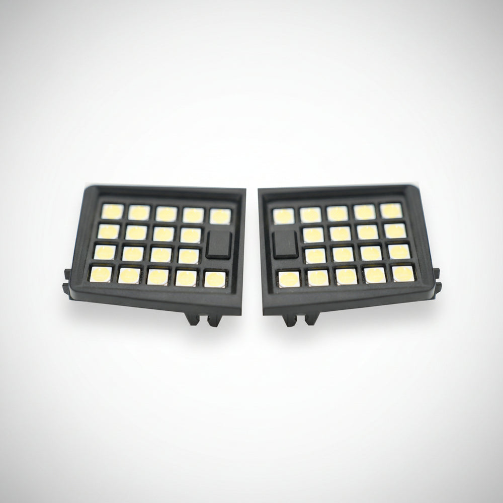 Two LED map lights with a black housing and clear lens, designed for a vehicle's interior.