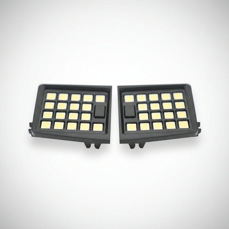 Two LED map lights with a black housing and clear lens, designed for a vehicle's interior.