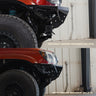 Compilation view of a Tacoma with the C4 Rock Runner bumper and standard front skid plate versus one with the Rock Runner Skid Plate with Crossmember Delete - a drastic difference in front approach angle and ground clearance forward of the front axle.